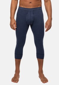 Marineblaue gestreifte Leggings mit tailliertem Design, verkürzter Länge und gerippten Knöchelbündchen, aus weichem, dehnbarem Stoff für optimalen Tragekomfort.