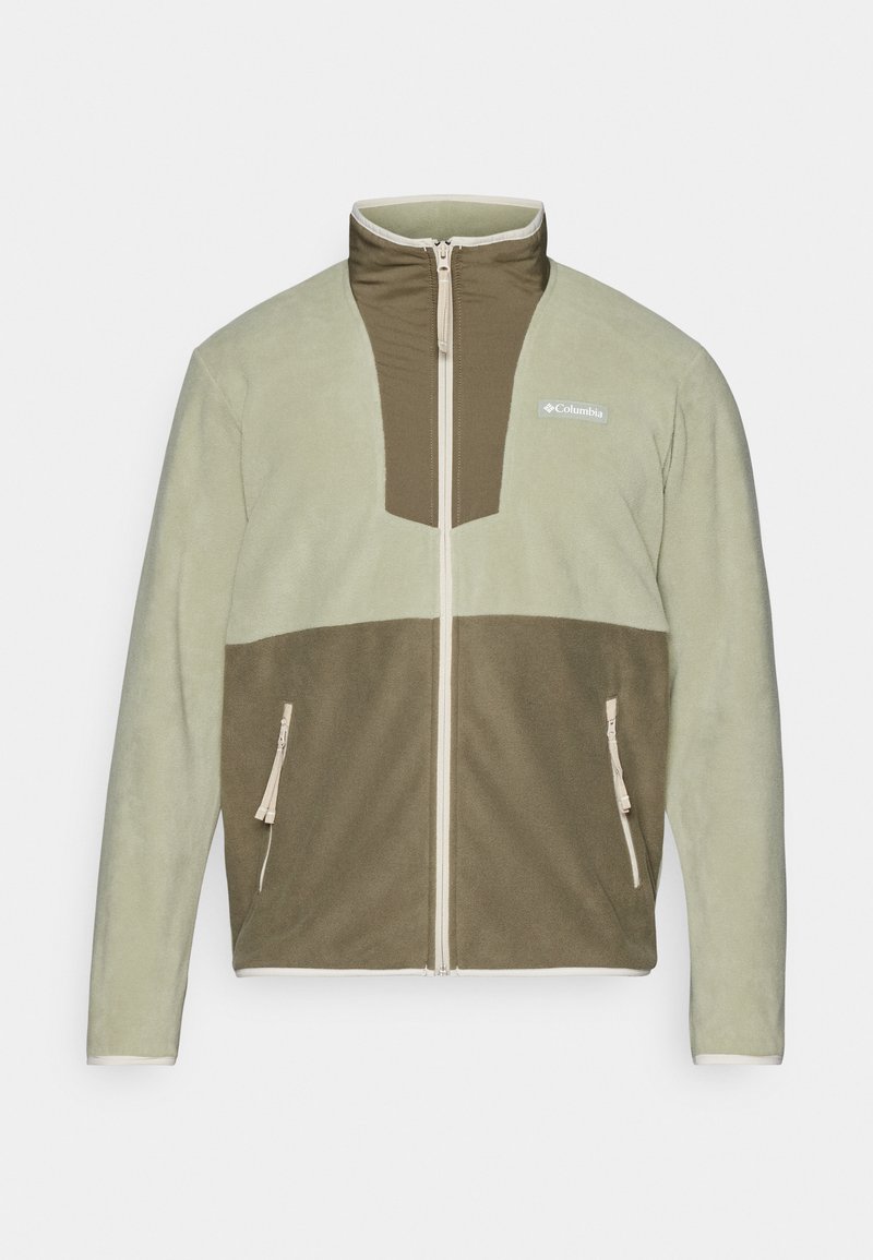 Veste en polaire avec un col haut, présentant un haut vert clair et un bas vert foncé. Poches zippées et logo sur la poitrine.