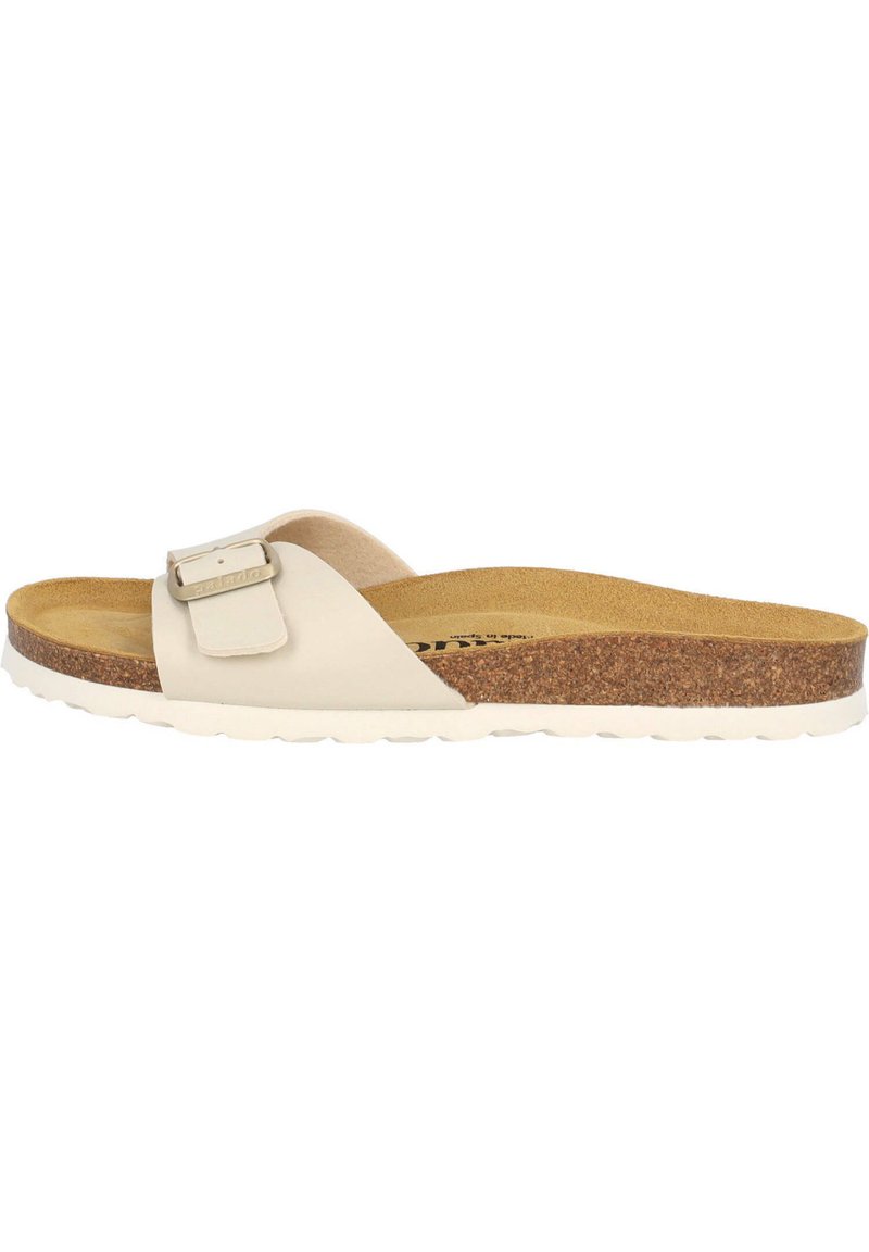 Rundsandal med en cremefärgad läderöverdel, justerbar spänne, kork-mellansula och vit gummiyttersula med texturerat mönster.