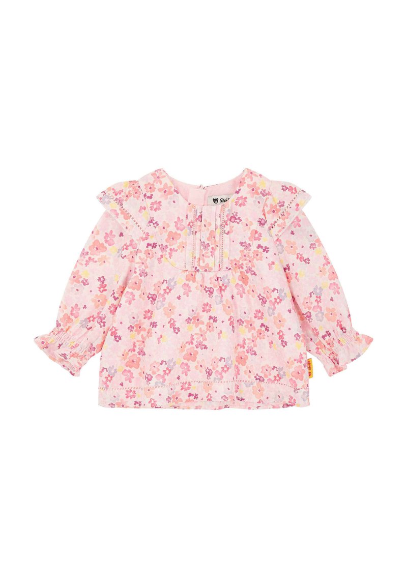 Haut à manches longues à motif floral rose, avec des épaules froncées, des poignets élastiques et des détails de couture subtils sur la poitrine.