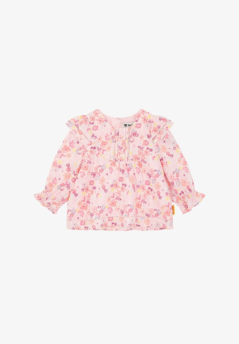 Haut à manches longues à motif floral rose, avec des épaules froncées, des poignets élastiques et des détails de couture subtils sur la poitrine.