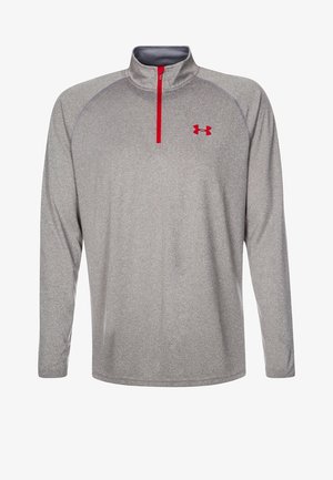 Pull-over de sport gris à manches longues avec fermeture éclair rouge au quart et logo rouge Under Armour sur la poitrine gauche.