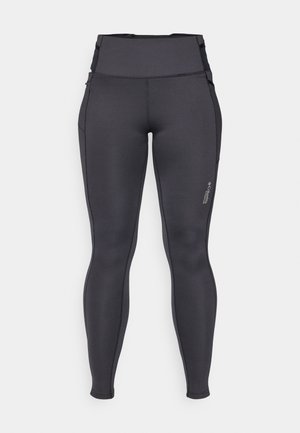 Leggings korkealla vyötäröllä, tiukasti istuvat, joustavaa tummanharmaata kangasta. Sisältää litteitä saumoja ja pienen logon lähellä alavartta.