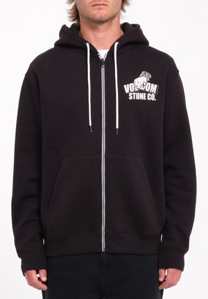 Black zip-up hoodie made from cotton blend fabric, featuring front pockets, white drawstrings, and printed logo on the left chest area.