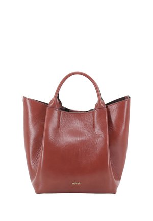 Brown leather handbag with short handles and a soft structure, featuring a small gold logo near the bottom center.