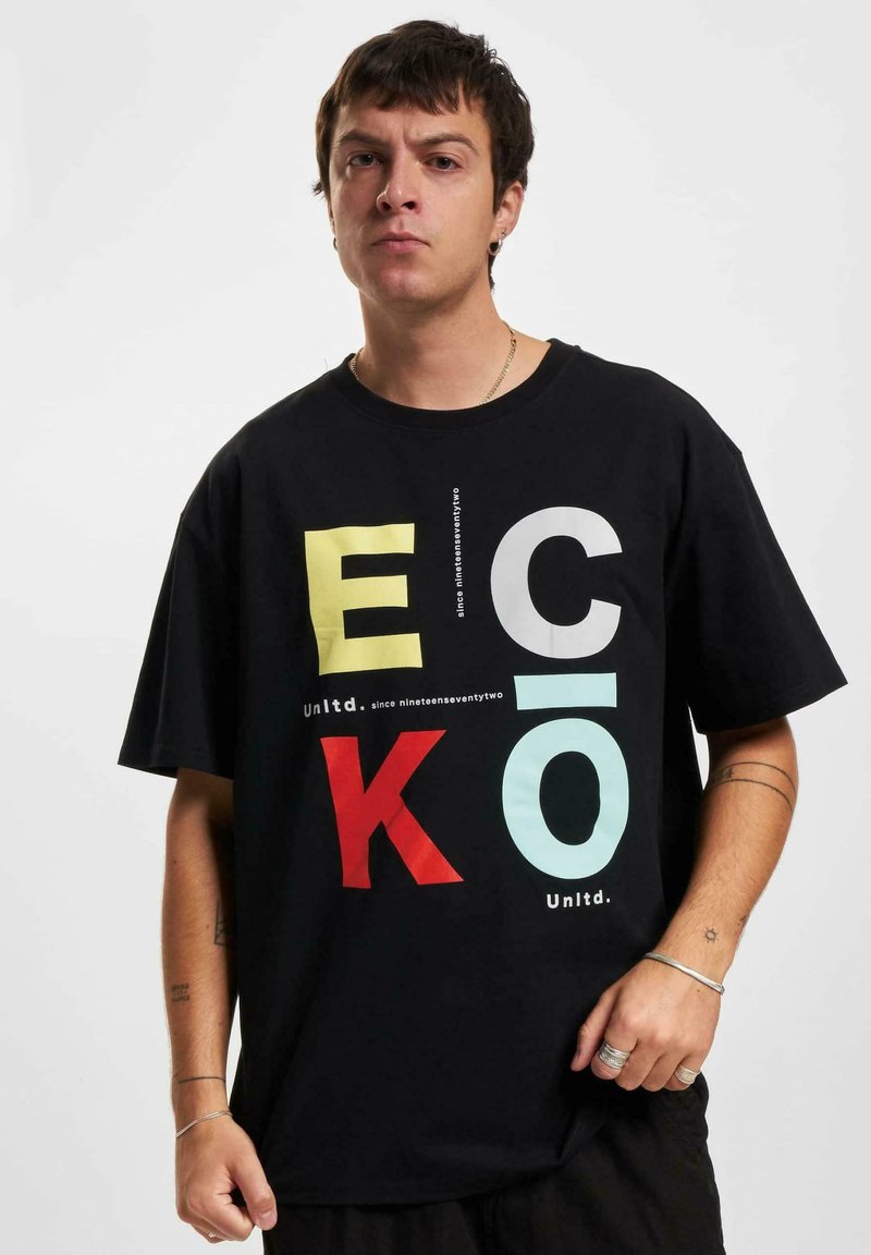 Black cotton t-shirt featuring large multicolored letters "E," "C," "K," and "O." Crew neckline, relaxed fit, with text detailing beneath the graphic.