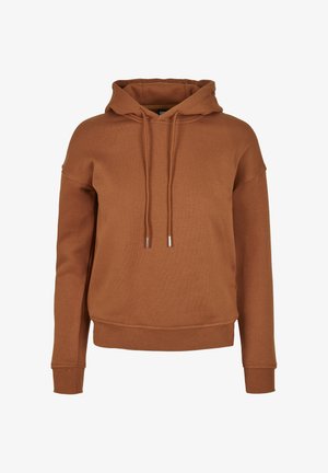 Barna kapucnis pulóver laza szabással, bordázott mandzsettákkal és szegéllyel. Zsinórja fém végekkel és puha, texturált anyagból készült.