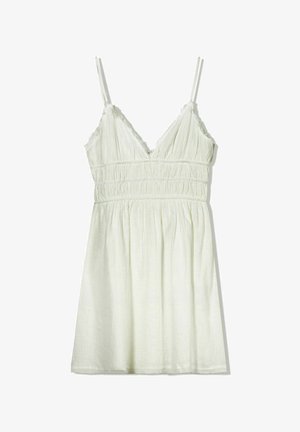Helles grünes Kleid mit verstellbaren Spaghettiträgern, geraffter Textur und V-Ausschnitt. Rüschensaum am Hals und an der Brust, fließender Rock.
