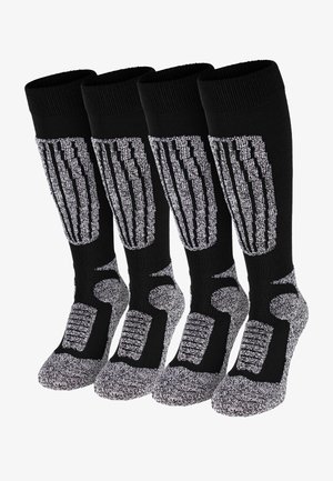 Black knee-high socks with four vertical silver stripes; textured soles and light grey toe and heel areas; ribbed cuffs for fit and comfort.