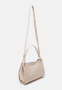 Coccinelle WALLACE - Käsilaukku - off-white/green