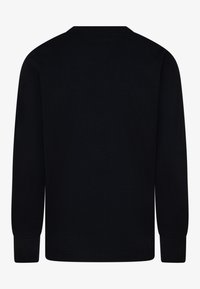 Svart långärmad t-shirt i mjukt bomullstyg med rund halsringning och ribbade mudd. En enkel design utan mönster eller detaljer.