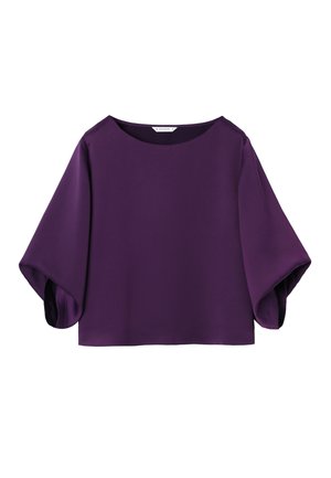 Blouse violette avec manches trois-quarts larges et évasées et encolure ronde, posée à plat sur fond blanc.