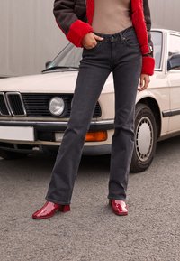 Levi's® SUPERLOW BOOTCUT - Bootcut jeans - first or last