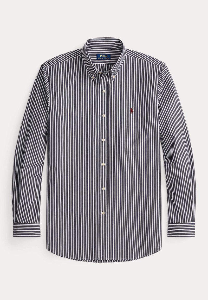 Chemise à boutons pour homme en rayures verticales bleu marine et blanches. Tissu en coton, manches longues et petit logo brodé sur la poitrine.