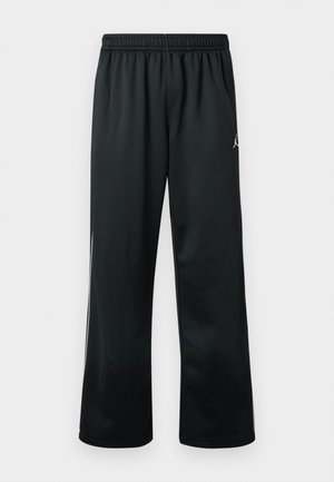 Pantaloni sport negri cu talie elastică, având un logo alb pe partea superioară și un material neted, ușor.