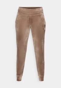 Sametové jogger nohavice v jemnej taupe farbe s prispôsobeným pásom. Majú zúžené nohavice, rebrované manžety a malé logo na ľavom boku.