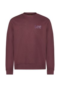 Felpa girocollo bordeaux con polsini e orlo a coste, caratterizzata da un piccolo logo "Lee" viola sul lato sinistro del petto.