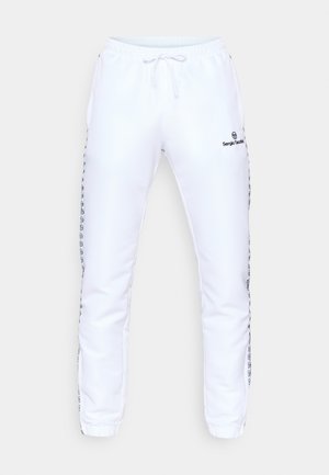 Hvite joggebukser med elastisk midjebånd, snøring, sidestrimler med svarte logoer, og liten svart logo på den øvre låret.