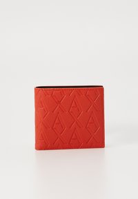 Red leather wallet with embossed geometric pattern and contrasting black interior. Rectangular shape, smooth texture, compact design.