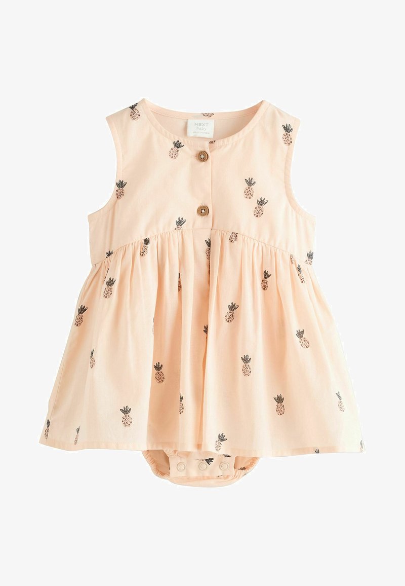 Robe pour bébé de couleur pêche, sans manches, avec une jupe froncée, des motifs d'ananas et des détails en boutons en bois. Comprend une fermeture à pression au bas.