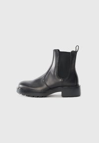 Black leather Chelsea boot with elastic side panels, rounded toe, chunky rubber sole, and a pull tab at the back.