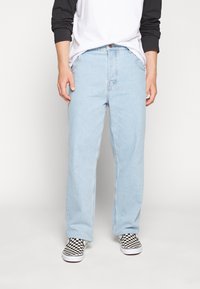 Light blue denim jeans with a relaxed fit, featuring a classic five-pocket design, contrasting stitching, and a button closure.