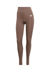 Leggings marroni con vita alta, realizzati in materiale elastico. Presentano un logo bianco Adidas sull'anca sinistra. Design liscio e aderente.