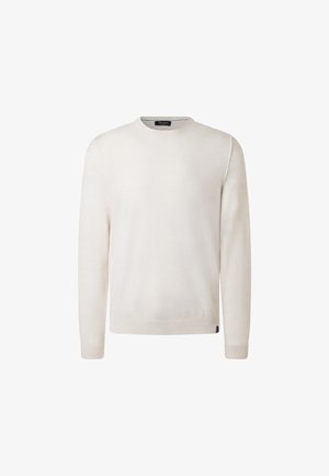 Light cream knit sweater with a round neckline, long sleeves, and ribbed cuffs, featuring a subtle texture and a branded label at the hem.
