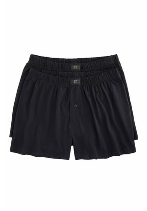 Schwarze Baumwoll-Boxershorts mit elastischem Bund und Knopfverschluss, in einem gestapelten Arrangement präsentiert.