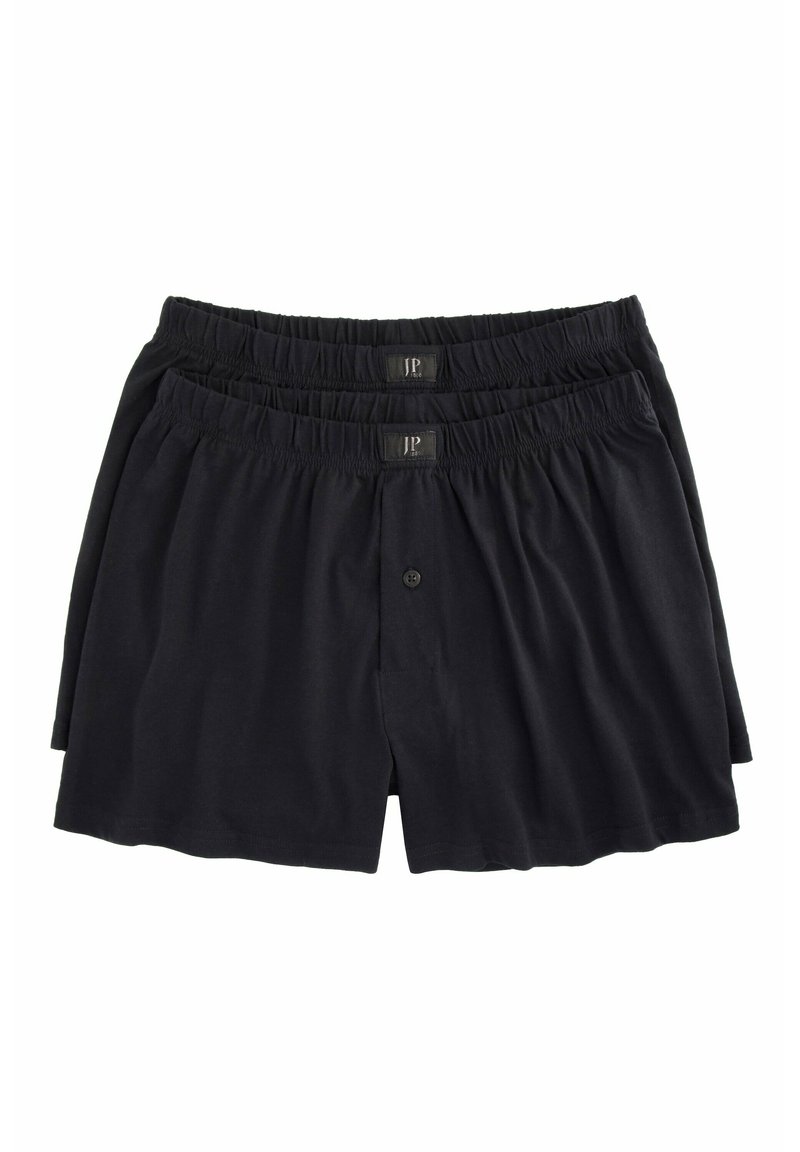 Shorts en coton noirs avec taille élastique et fermeture à bouton, présentés dans un arrangement en pile.