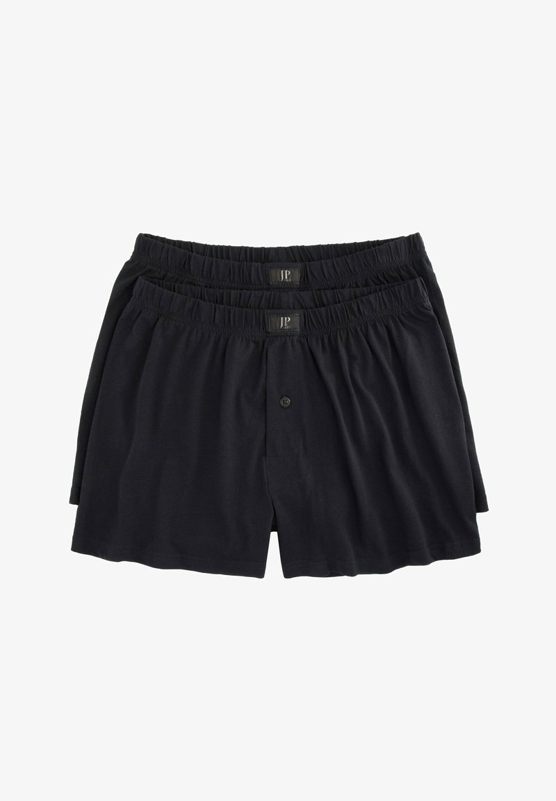 Boxer in cotone nero con elastico in vita e chiusura a bottone, esposti in un arrangiamento impilato.
