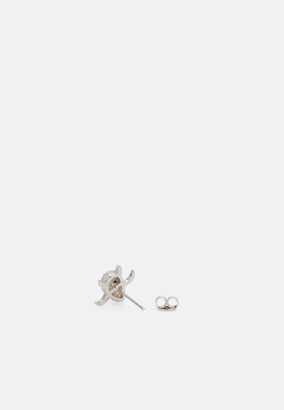 Silver stud earring in a floral design with a textured blossom and curved petals. Includes a secure butterfly backing.
