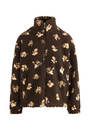 Rjava jopa iz flisa s kremnimi cvetličnimi vzorci, visokim ovratnikom in zadrgo na sprednji strani. Ima stranske žepe in teksturirano površino.