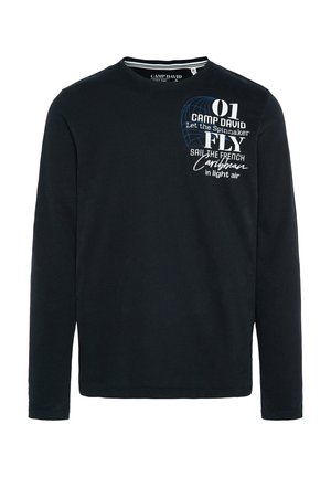 Camiseta negra de manga larga hecha de algodón. Presenta texto impreso en blanco y azul y un gráfico de un spi. Cuello redondo y corte regular.