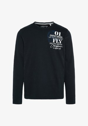 Camiseta negra de manga larga hecha de algodón. Presenta texto impreso en blanco y azul y un gráfico de un spi. Cuello redondo y corte regular.