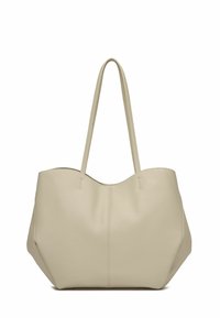 Geantă de umăr din piele bej, cu două curele lungi, formă rotundă, suprafață texturată și detalii de cusătură subtile pe față.