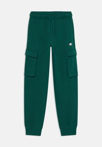Jogging cargo vert en matière douce, avec deux poches latérales, une taille élastique avec cordon de serrage et des poignets côtelés.