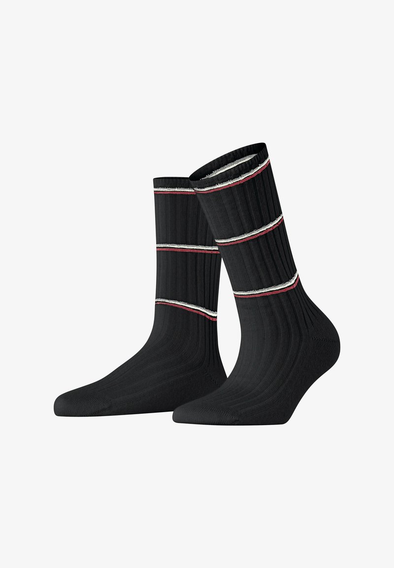 Calze nere a coste con due strisce orizzontali, una rossa e una bianca, nella parte superiore. Texture morbida con punta e tallone rinforzati.