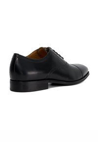 Black leather dress shoe with a smooth finish, rounded toe, intricate stitching, and a low heel for stability and comfort.