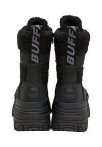Pair of black Buffalo brand winter boots with thick soles, fleece lining, and pull tabs labeled "BUFFALO" on the back.