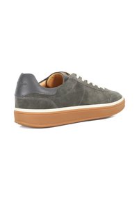 Gray suede sneaker with white laces, beige sole, and a dark gray heel cap. Features smooth texture and minimalistic design.