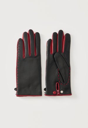 Par de guantes de cuero negro con costuras y forro rojos, uno mostrando la palma con detalle de botón a presión, el otro mostrando el reverso.