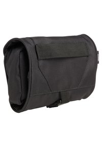 Black nylon bag with a rectangular shape, featuring a flap closure and adjustable strap, textured surface and minimalistic design.