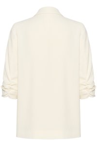 Blusa crema a maniche lunghe con maniche arricciate e colletto classico, vista da dietro su sfondo bianco.