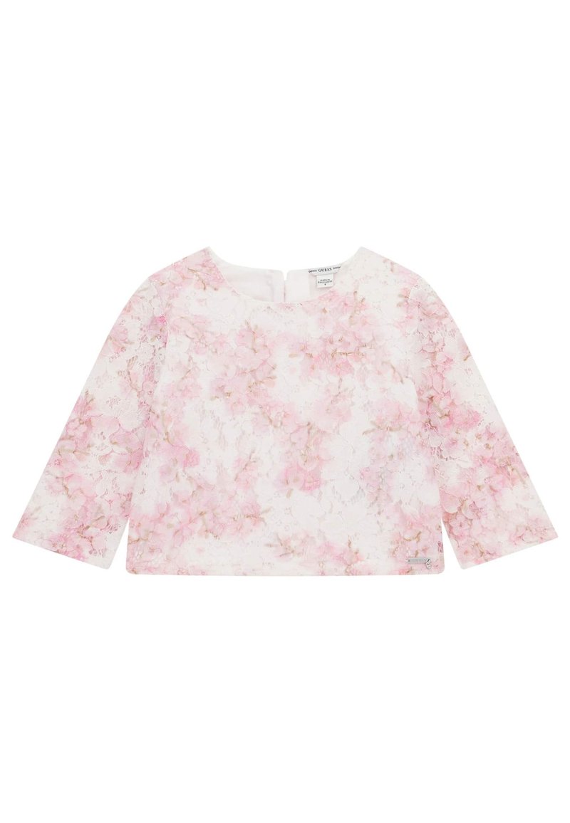 Blusa a maniche lunghe bianca con un motivo floreale in delicate tonalità di rosa. Presenta un collo rotondo e una piccola apertura posteriore per la chiusura.