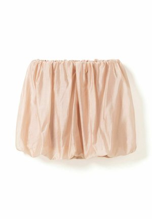 Jupe bouffante beige volumineuse avec taille élastiquée froncée et texture de tissu doux et brillant, présentée à plat sur un fond blanc.