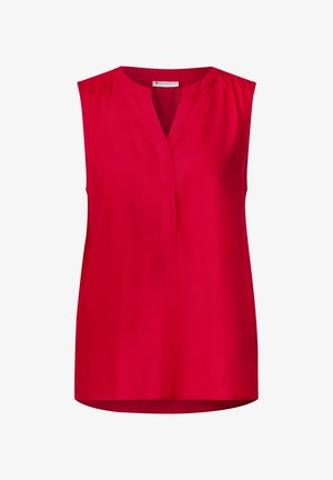 Červená bezramínková blůza s V-výstřihem, vyrobená z hladké látky. Obsahuje jemné sklady na ramenech a zaoblený lem. Jednoduchý a nezdobený design.
