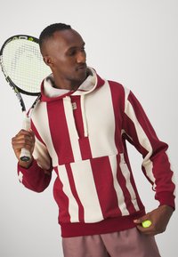 Nike Performance Hoodie - team red/coconut milk