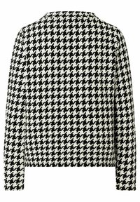 Zwart-witte houndstooth-gepatenteerde jas met lange mouwen, een ronde halslijn en een gestructureerde stof. De achterkant heeft een rechte snit.
