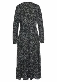 Schwarzes Langarmkleid mit floralem Muster in Hellblau und Weiß, entspanntem Schnitt und einem gestuften, fließenden Rock.